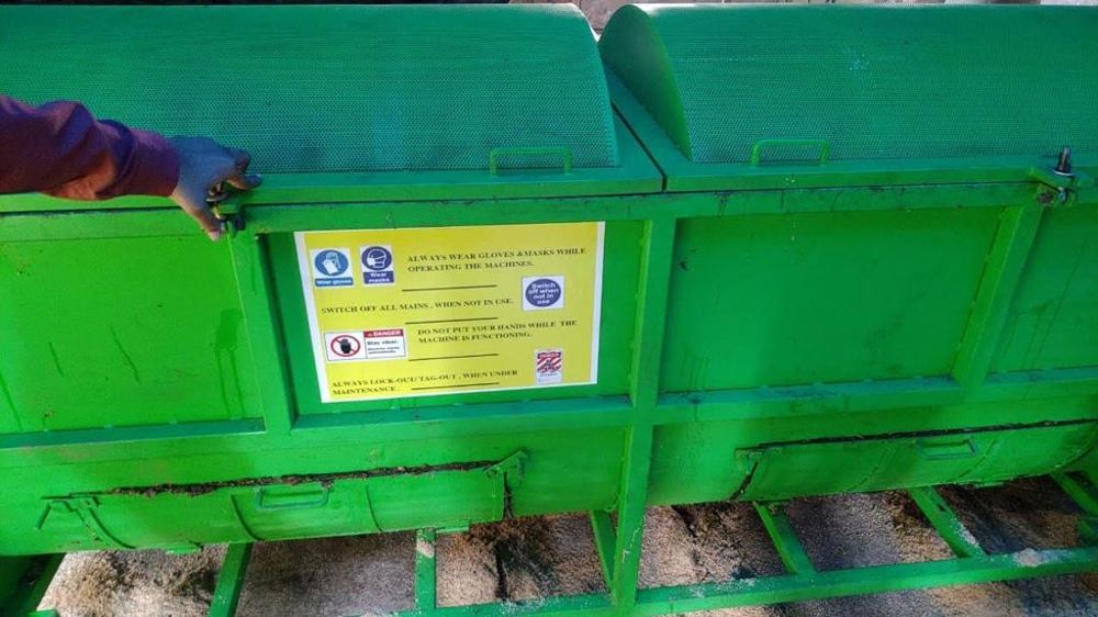 Safety signage on a waste processing machine